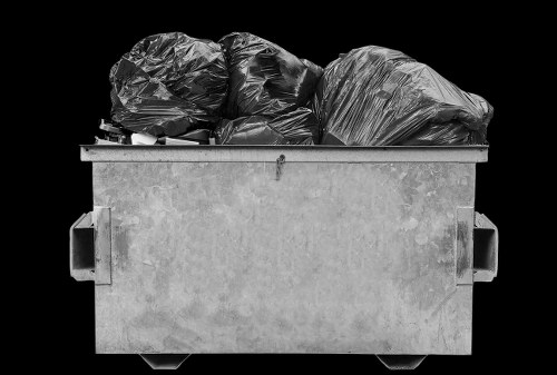 Spill response kit and containment equipment beside a skip