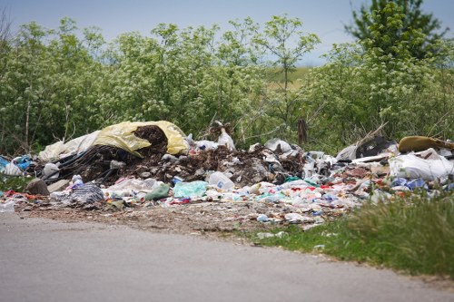 Workers managing construction waste responsibly